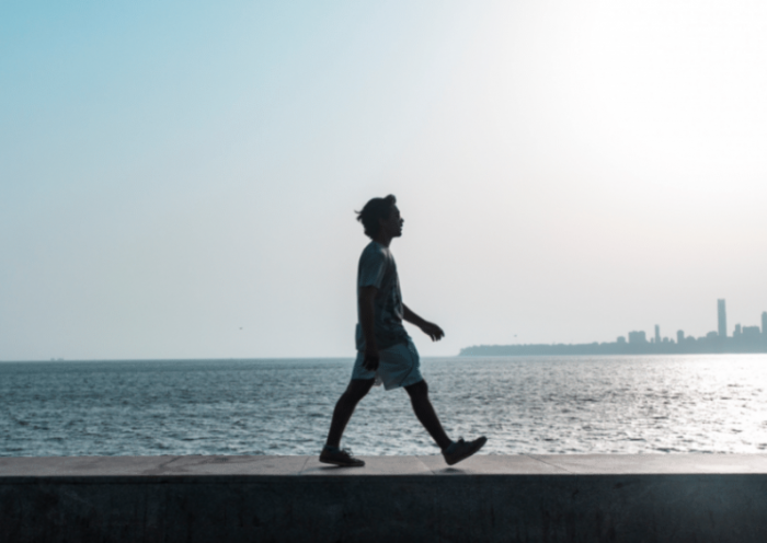 man walking on the seaside