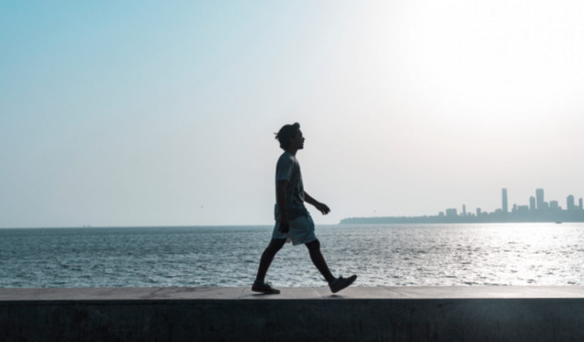 man walking on the seaside